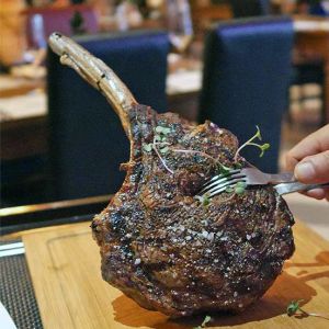 Savor the Best Juicy Tomahawk Steak in Coral Bay O
